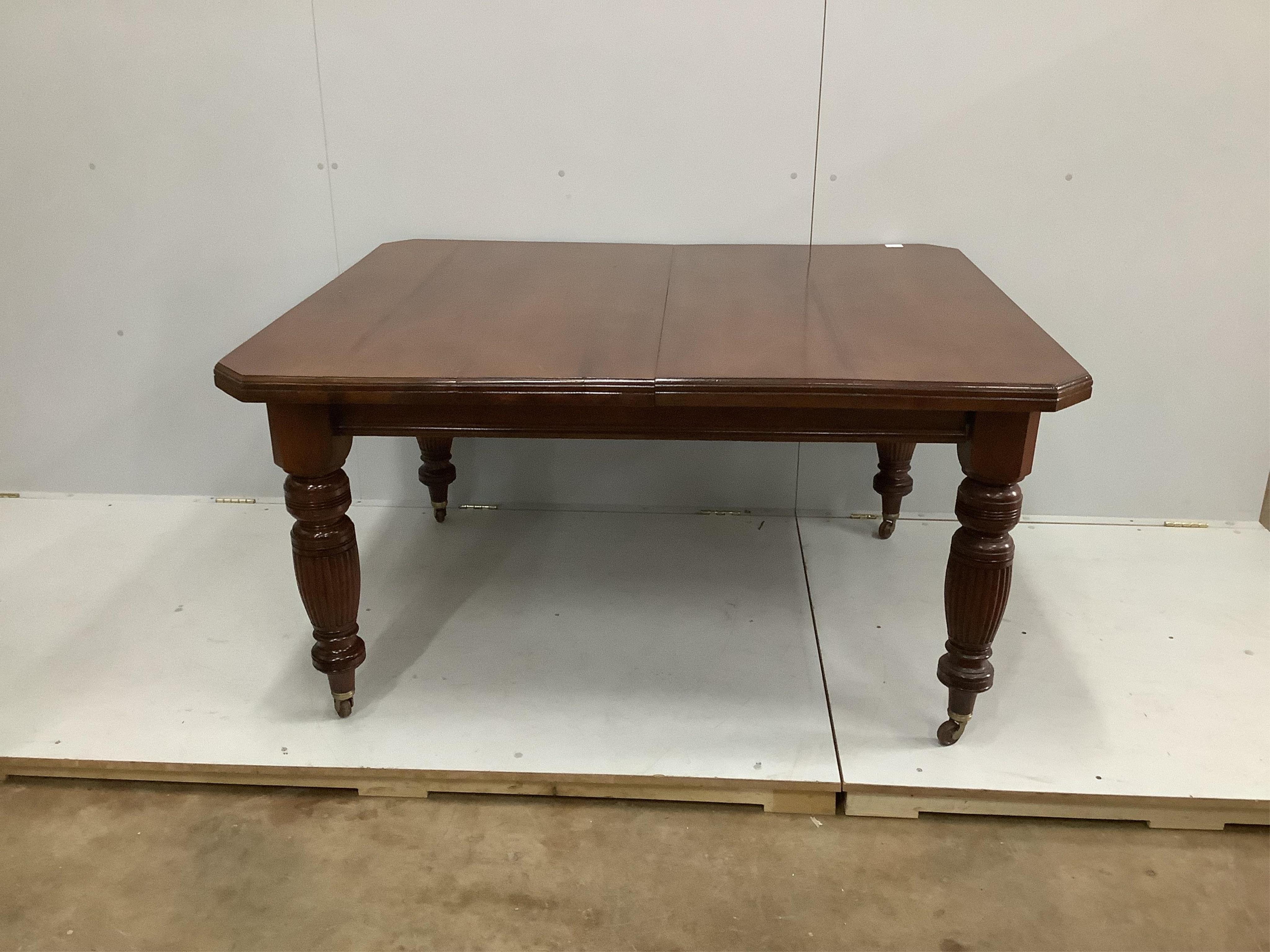 A late Victorian walnut extending dining table, width 232cm extended, two spare leaves, depth 118cm, height 73cm. Condition - good